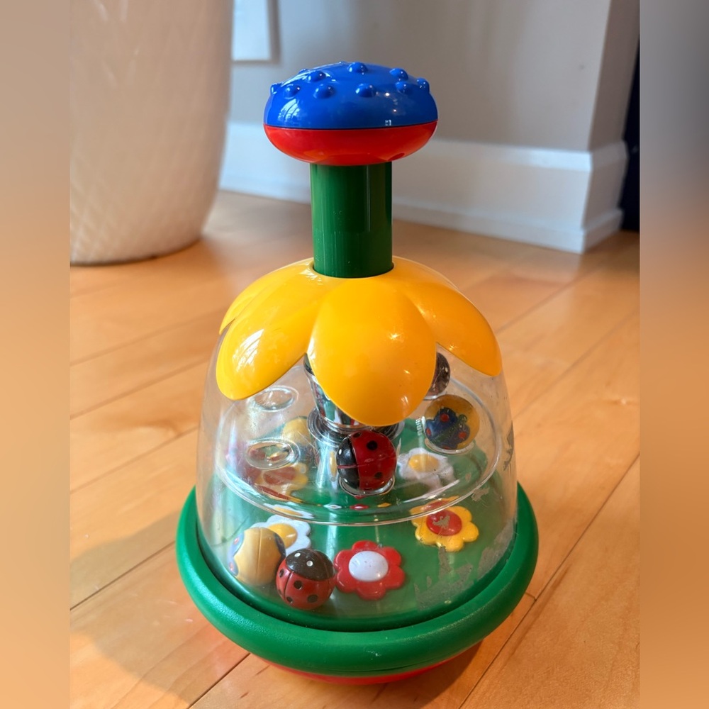 Infant toy for babies Yellow & Green Spinning Flower Pop Toy for Kids